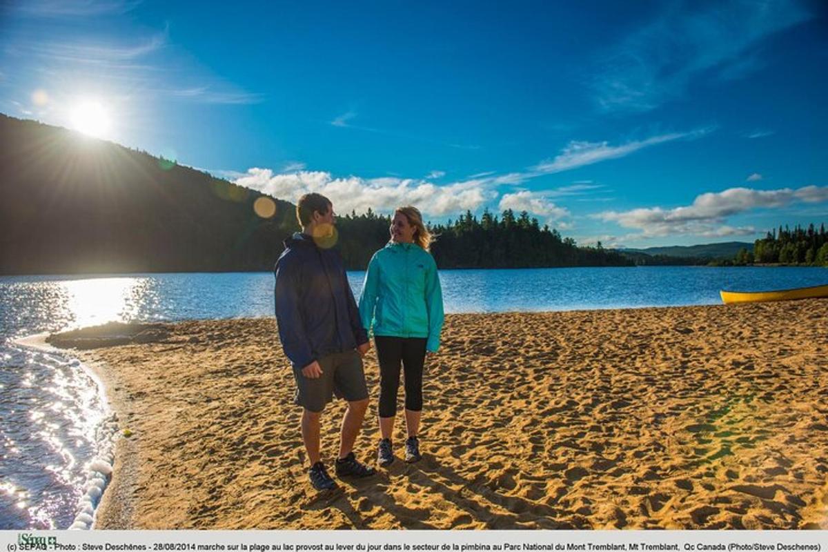 a man and a woman standing on a beach