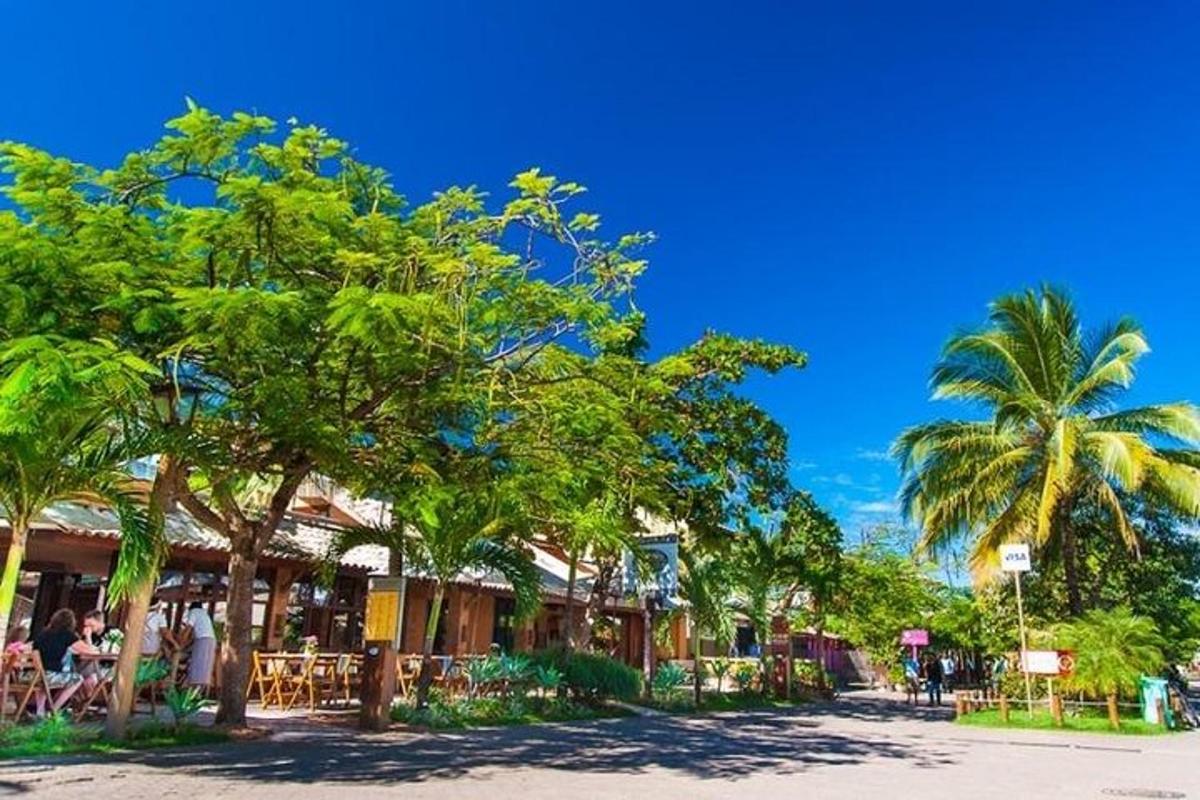 a street with palm trees in front of a building