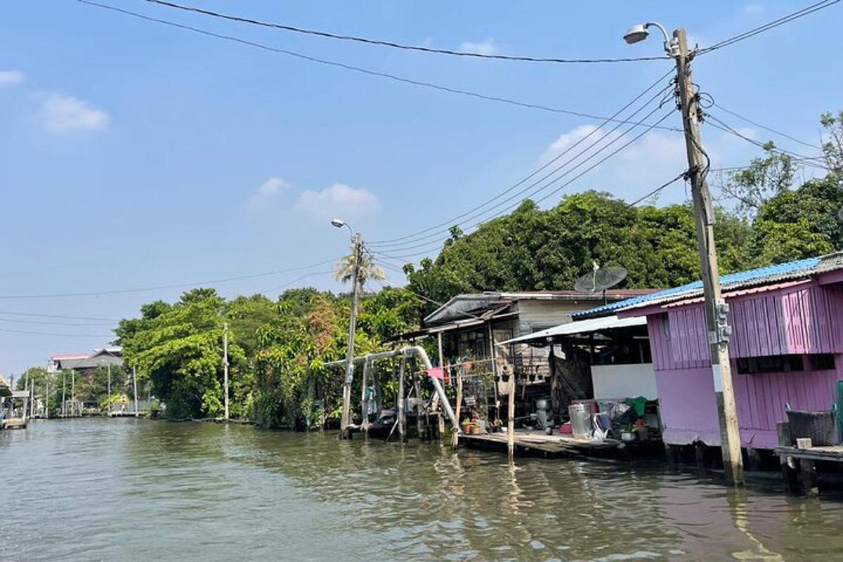 a group of houses on a river next to a riverurrency sidx sidx