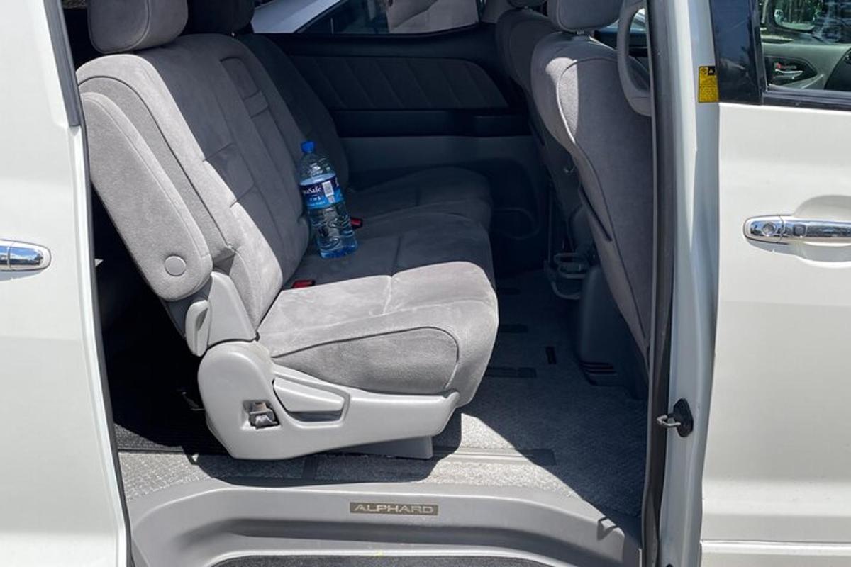 a bottle of water sitting in the back seat of a car