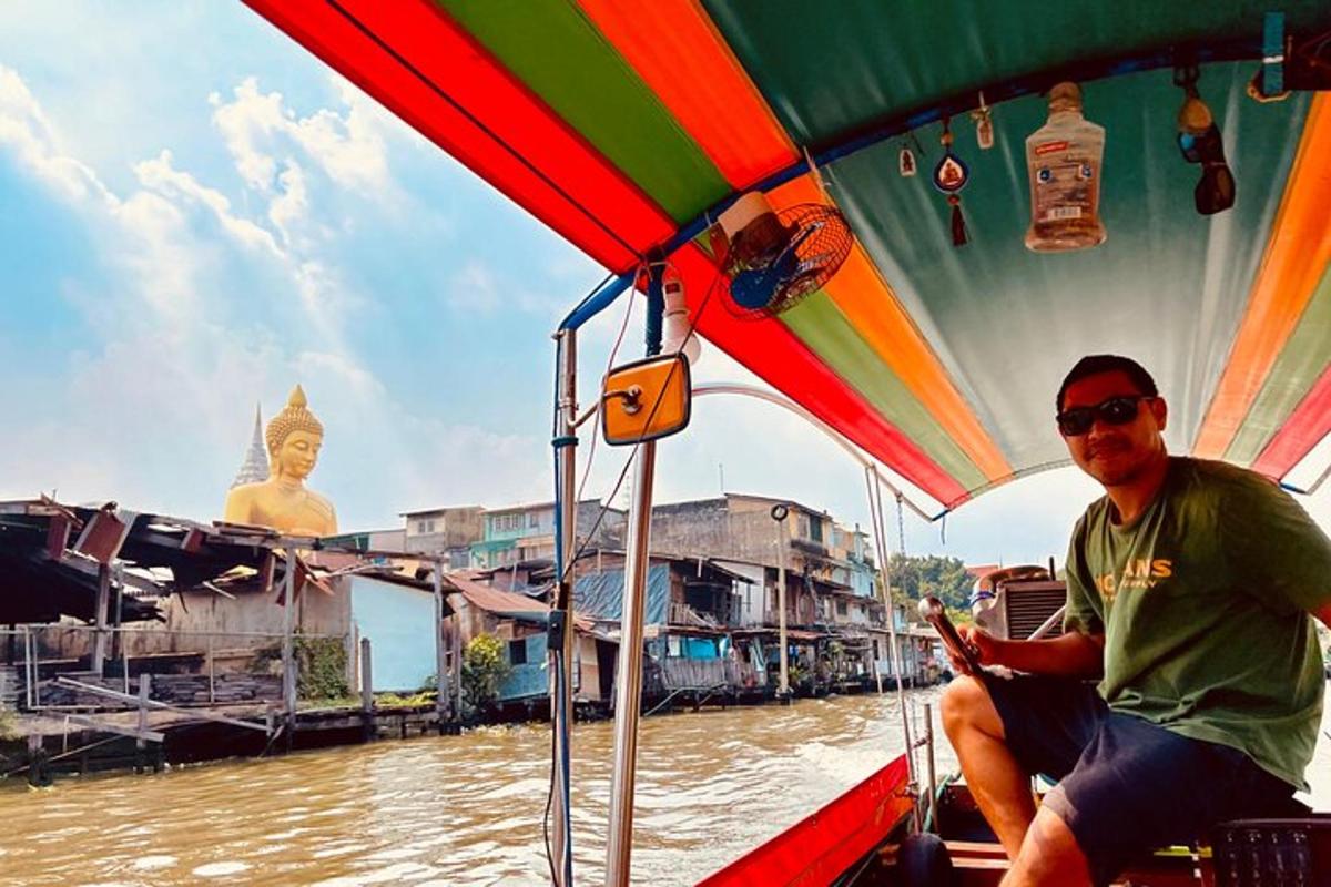 a man sitting in a boat on a river