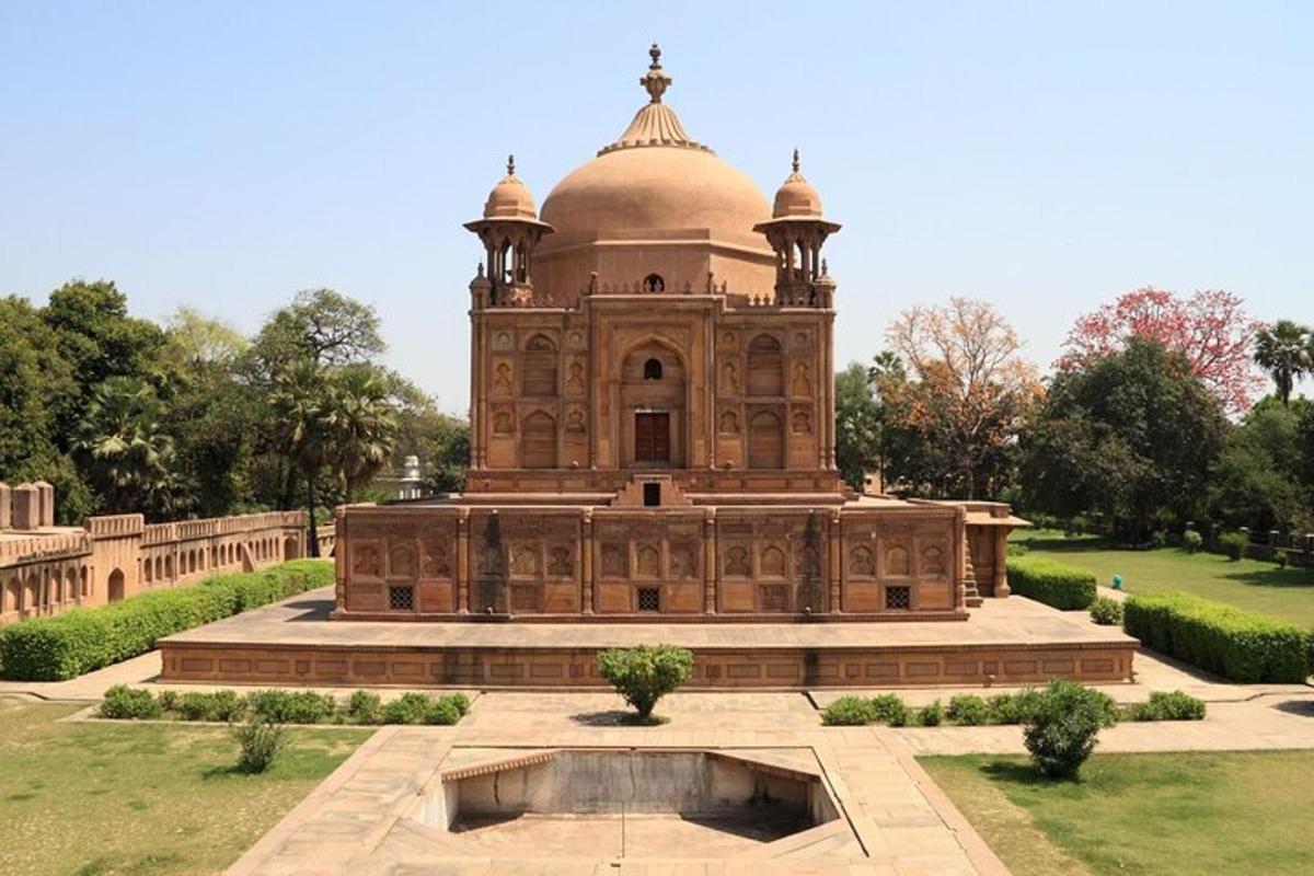 a large building with a fountain in front of it