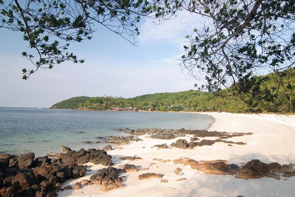 a view of a beach with rocks and the ocean
