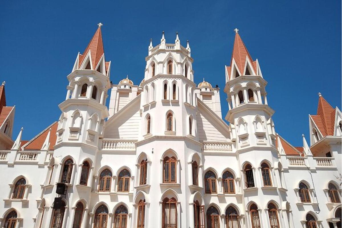 a large white building with towers on top of it