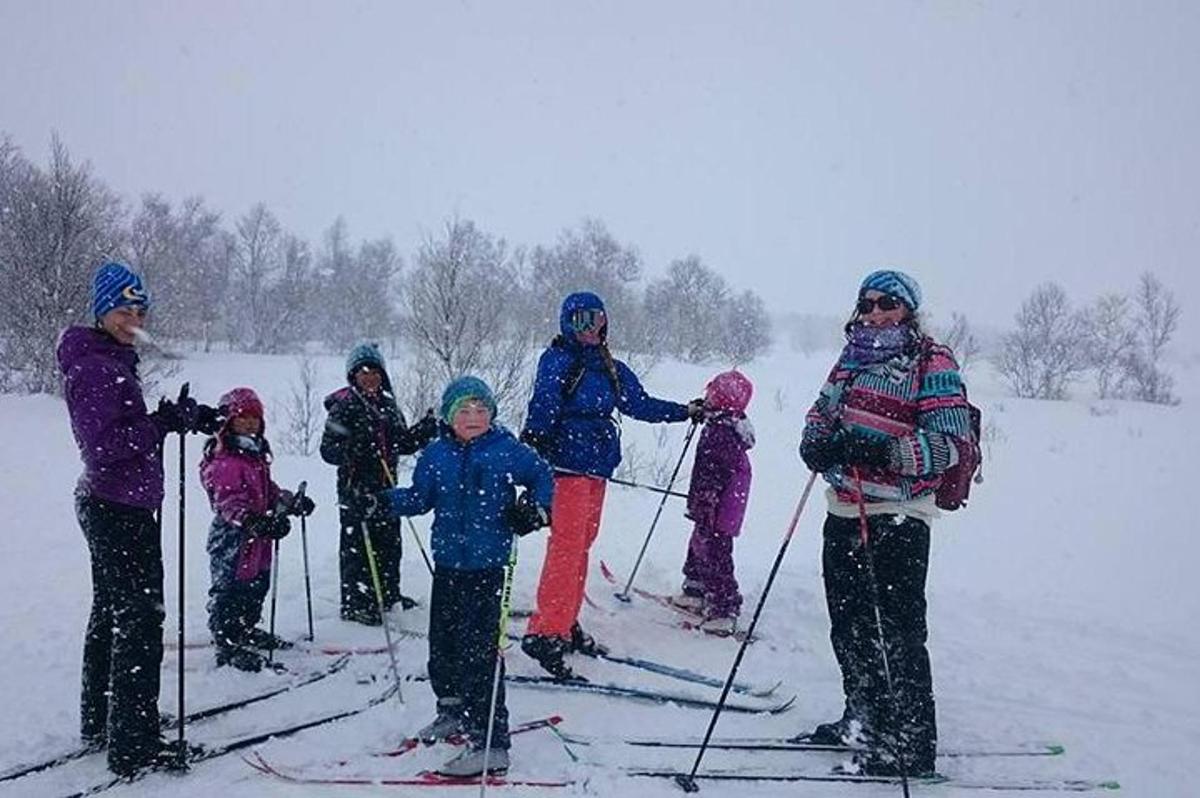 a group of people on skis in the snow