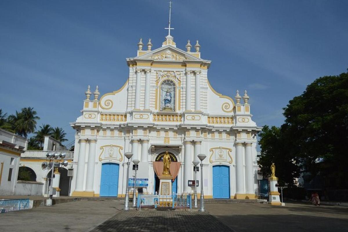 a large white building with a clock on it