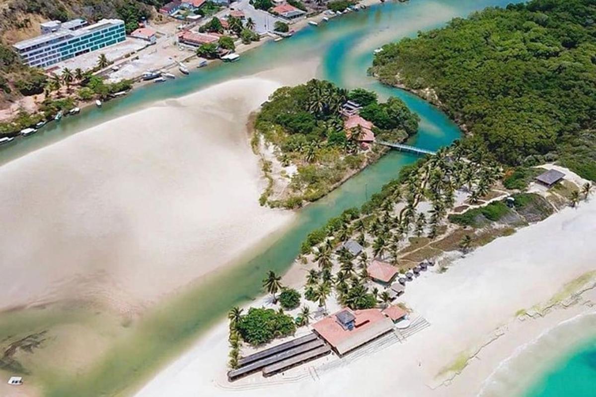 an aerial view of a tropical island in the water