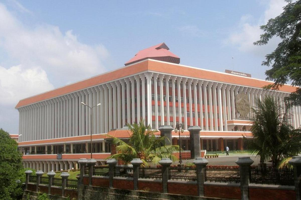 a large white building with a red roof
