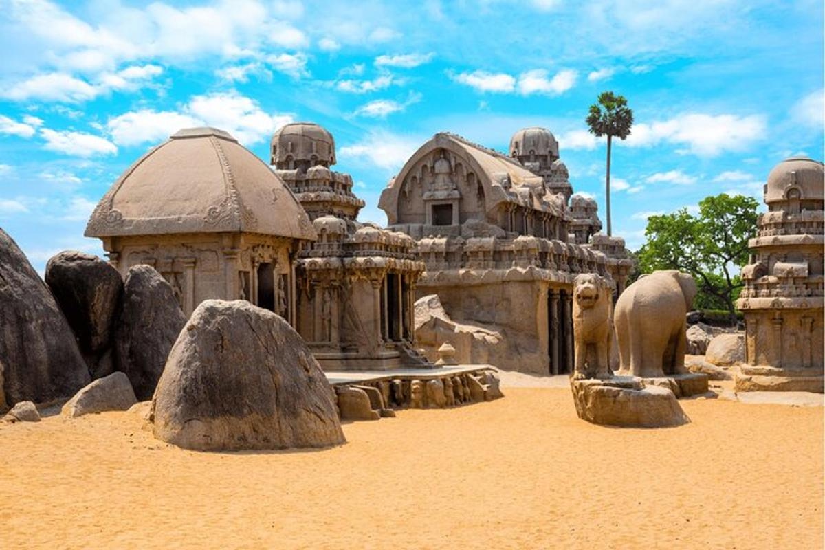 a building in the desert with rocks in front of it