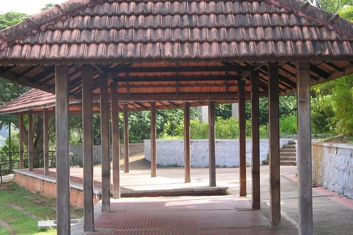 a large wooden pavilion in a park