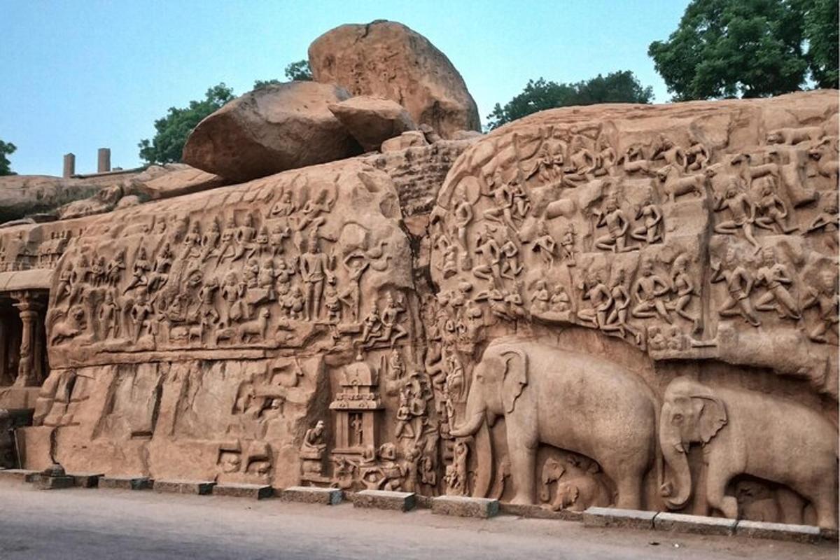 a large stone wall with animals on it