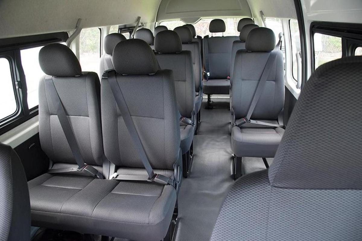 a row of seats in the back of a bus