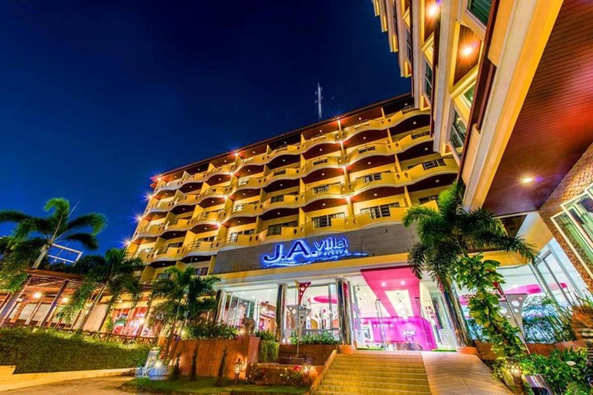 a jamaica hotel with palm trees in front of it