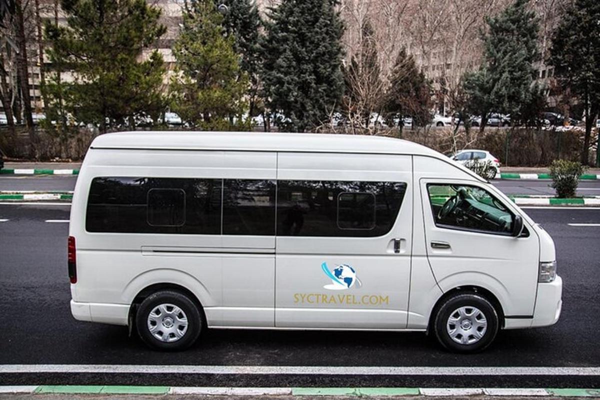a white van is parked in a parking lot