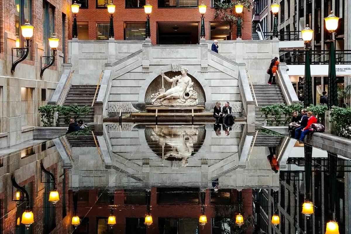 a fountain in the middle of a city with people