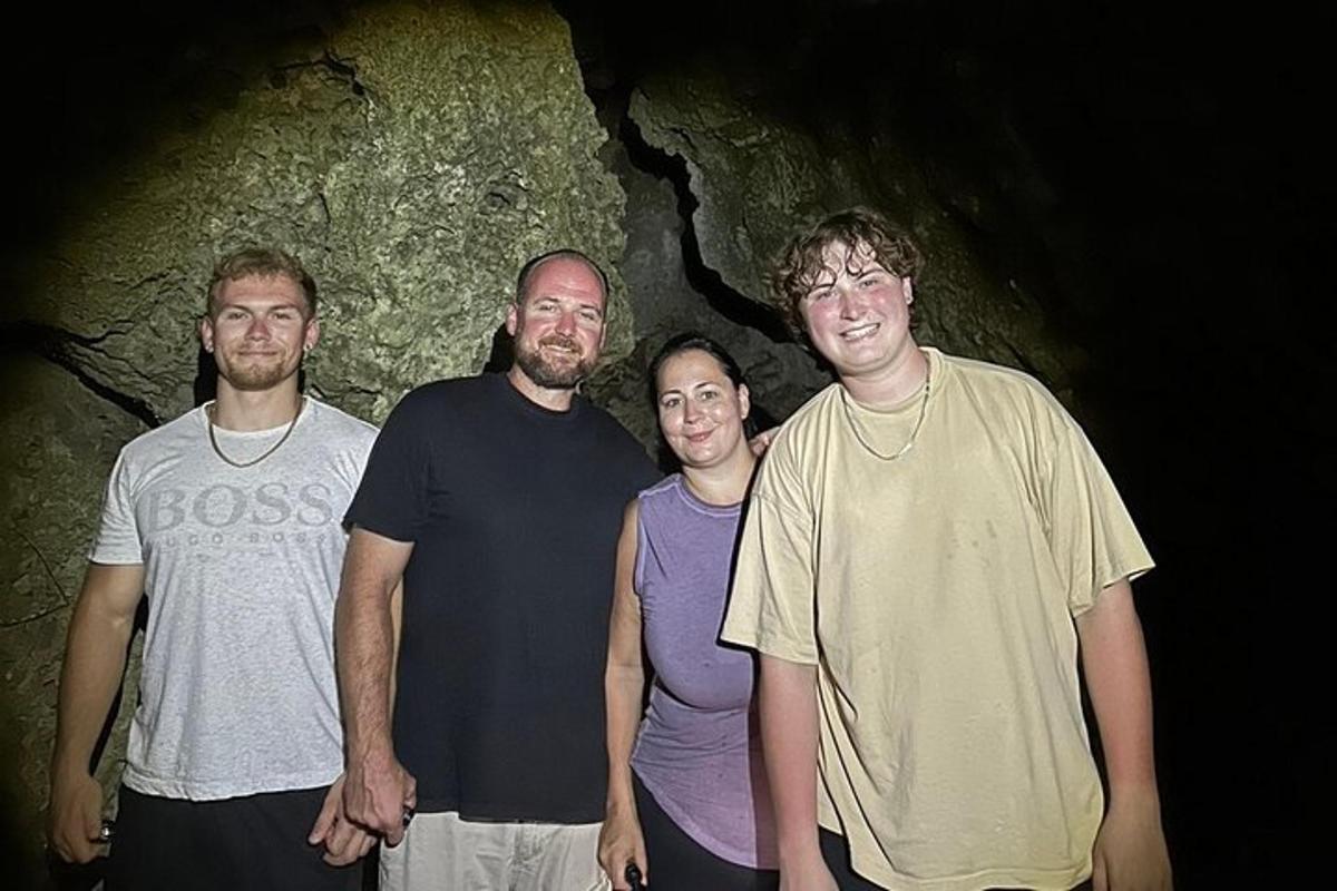 a group of men standing in a cave