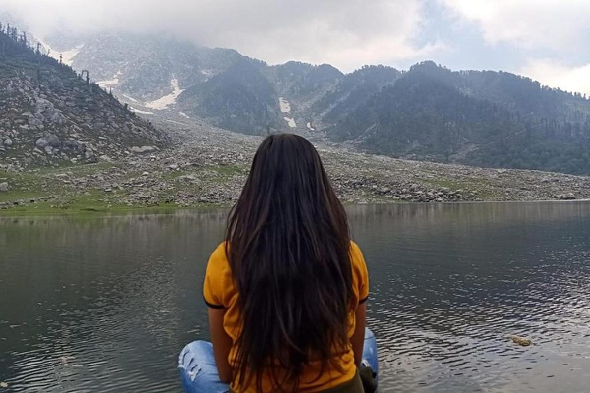 a woman sitting on a raft in a lake