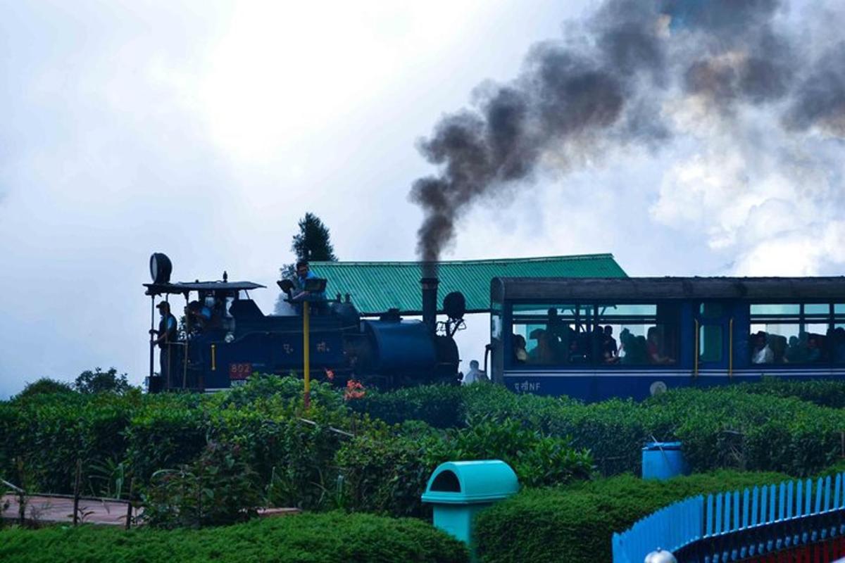 a steam train with black smoke coming out of it