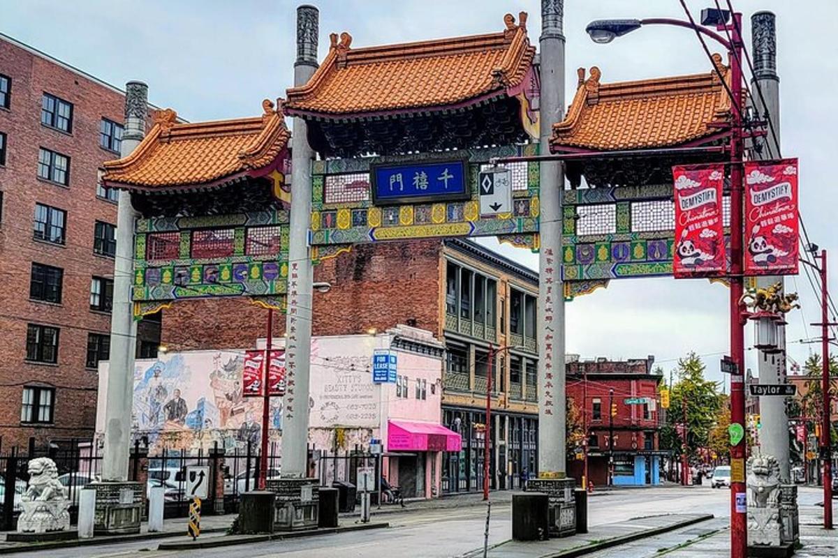 a city street with a building with chinese signs on it