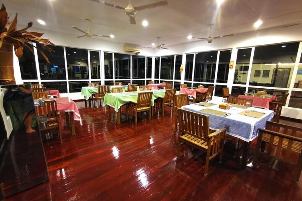 a dining room with tables and chairs in a restaurant