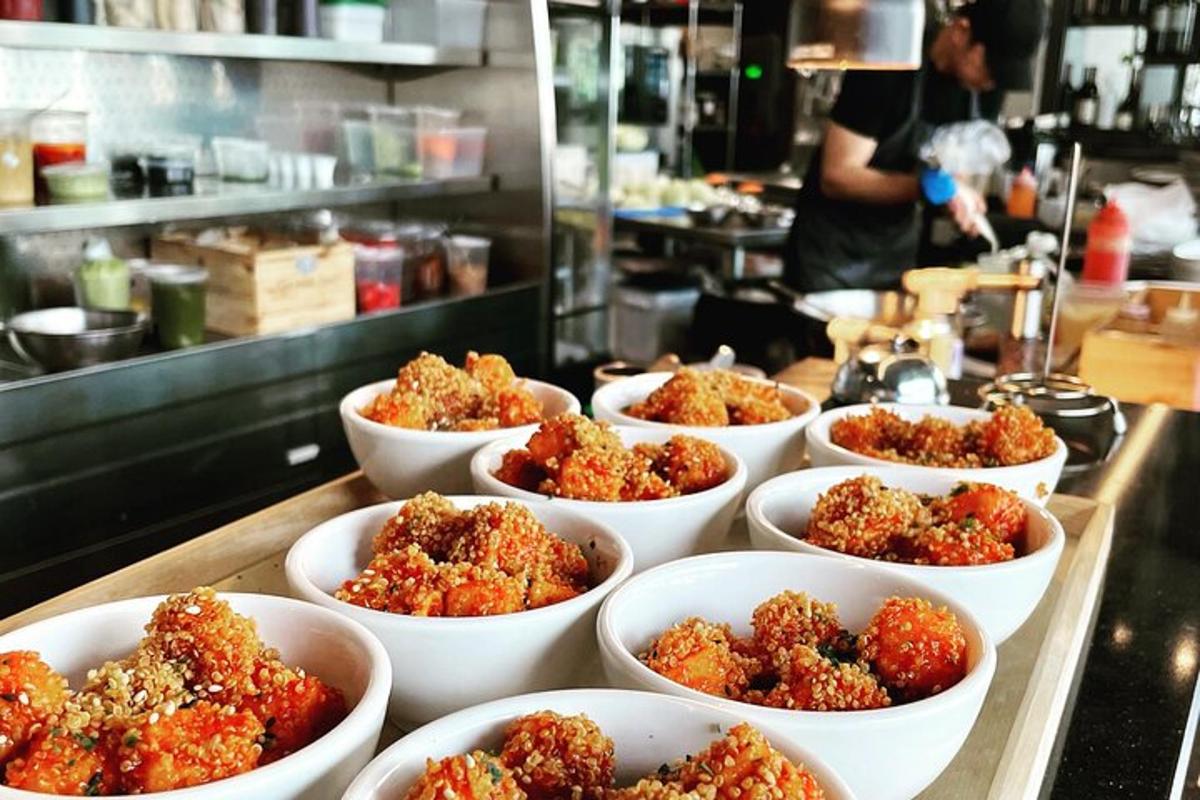a bunch of bowls filled with food on a counter