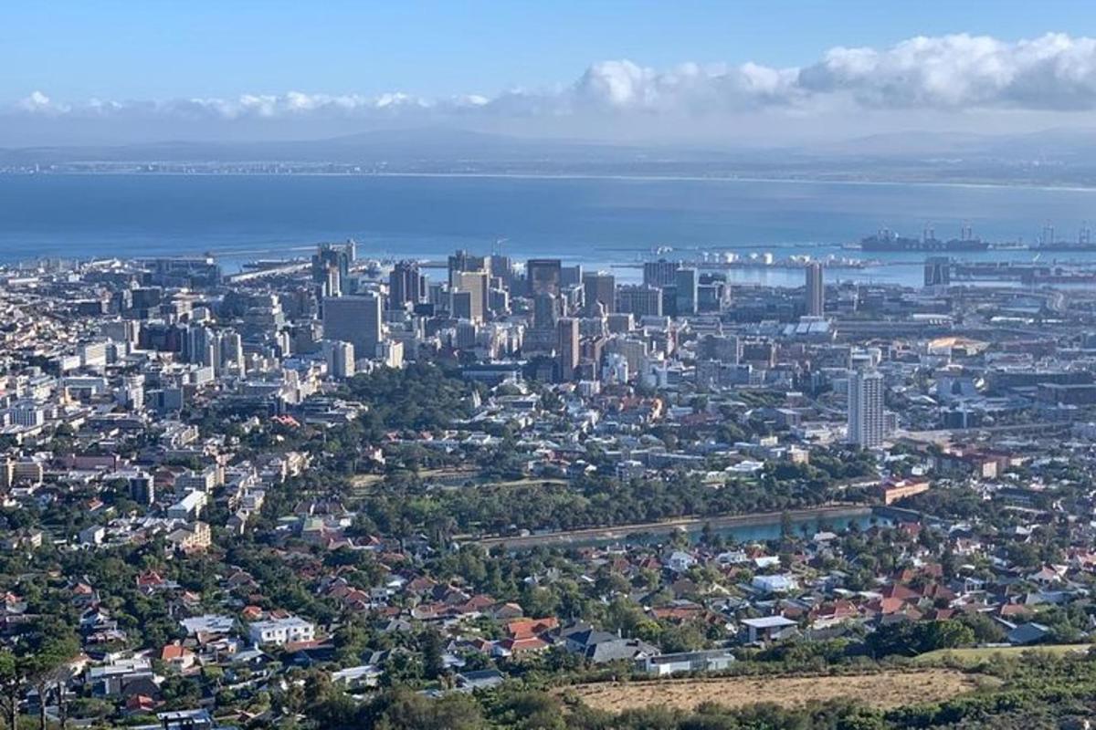 an aerial view of a large city with the ocean
