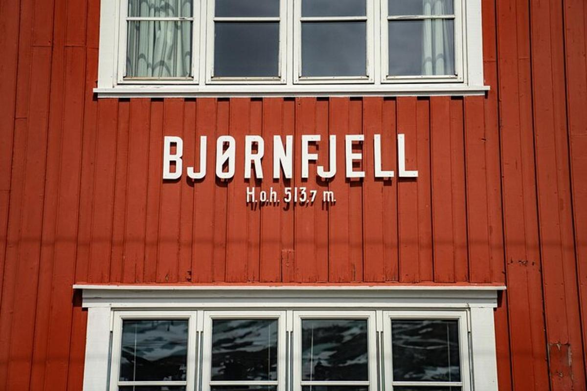 a sign on the side of a red building
