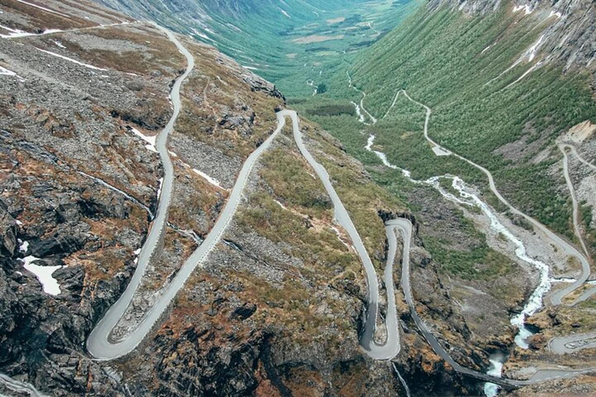 a winding road on the side of a mountain