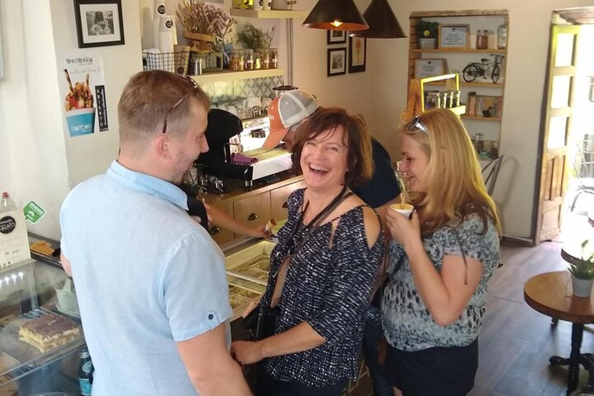 a man and two women standing in front of a counter