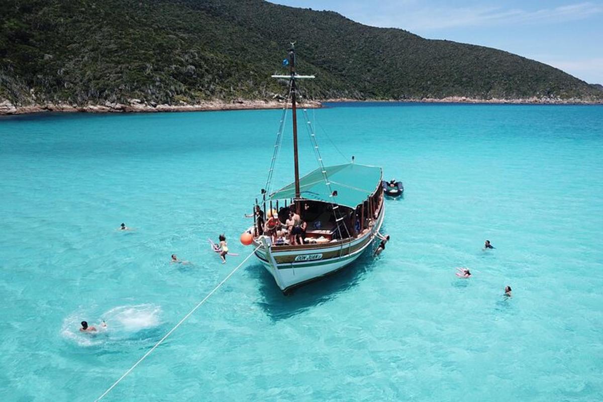 a group of people on a boat in the water