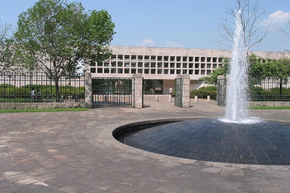 a fountain in a courtyard in front of a building