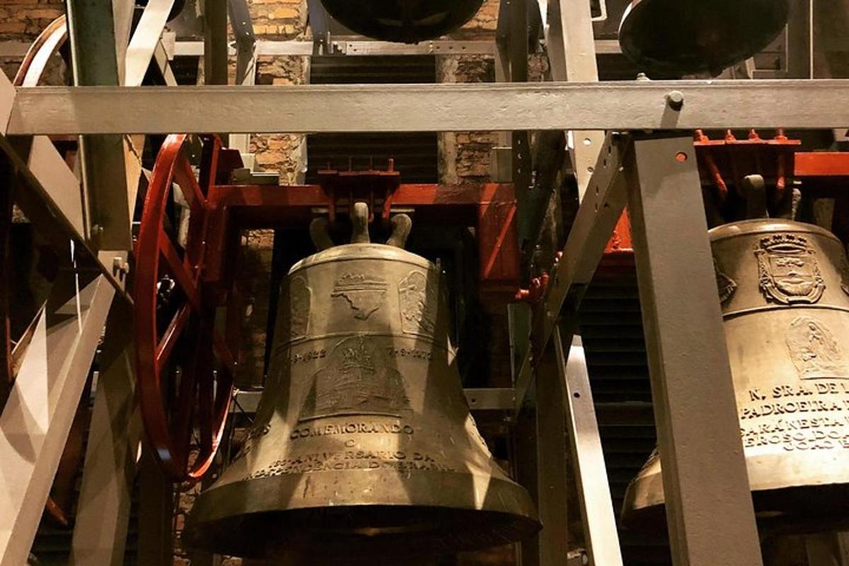 a large bell is hanging in a machine