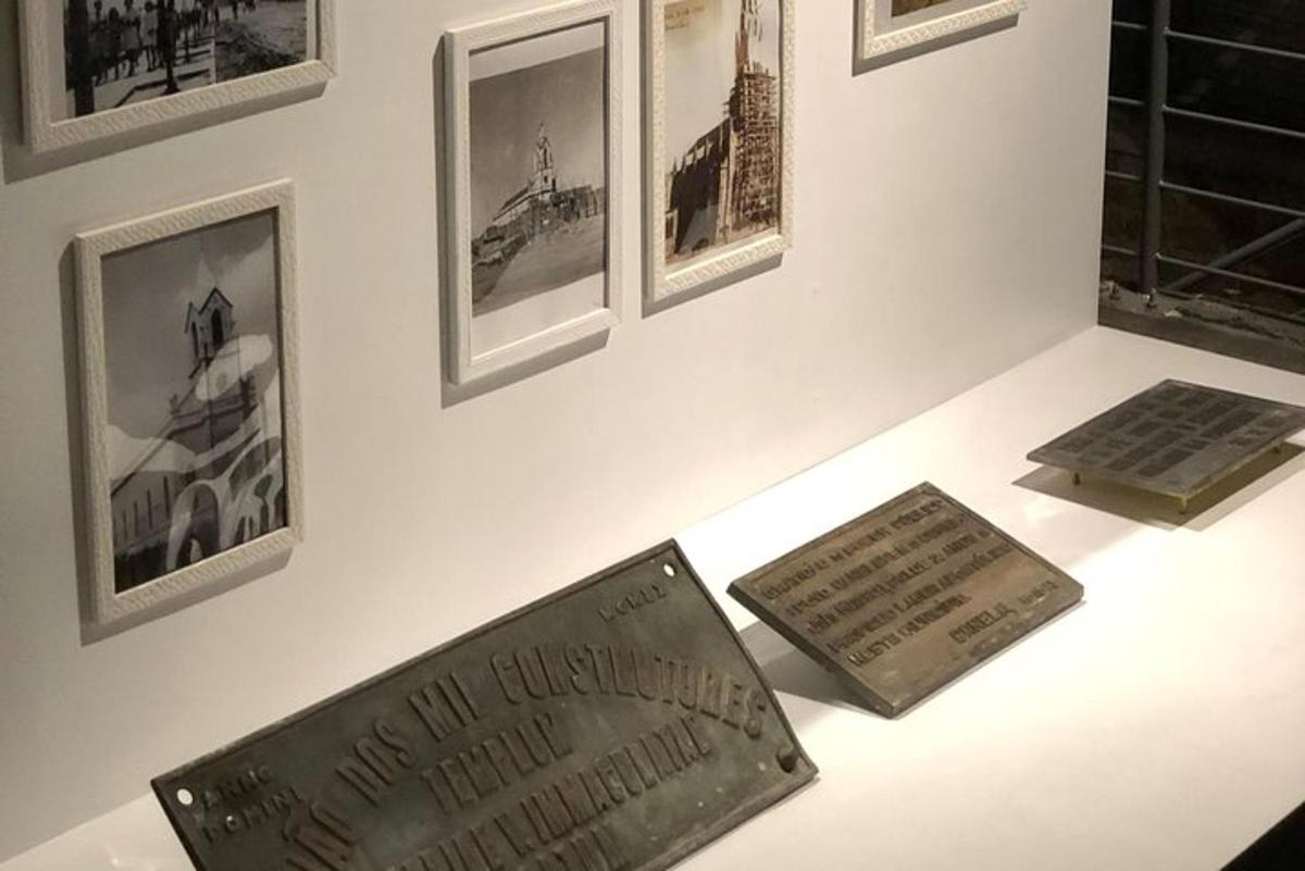 a table with two signs on a wall with pictures