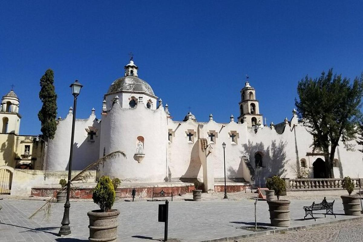 a large white building with two towers on top of it