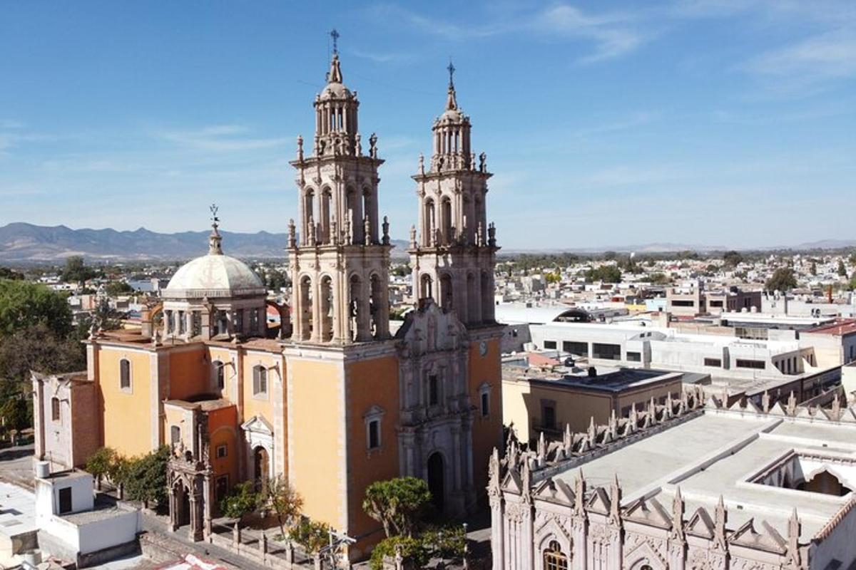 a church with two towers on top of a city