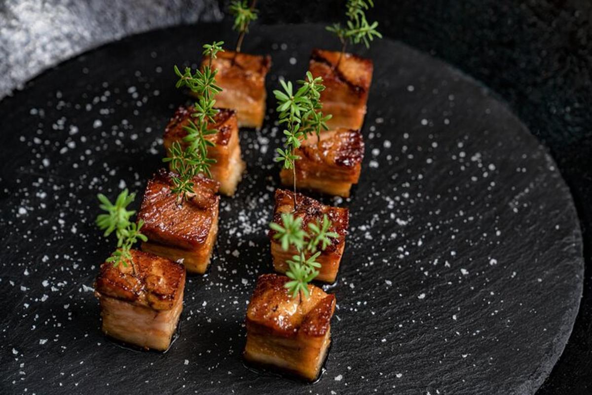 a black plate with a bunch of food on it
