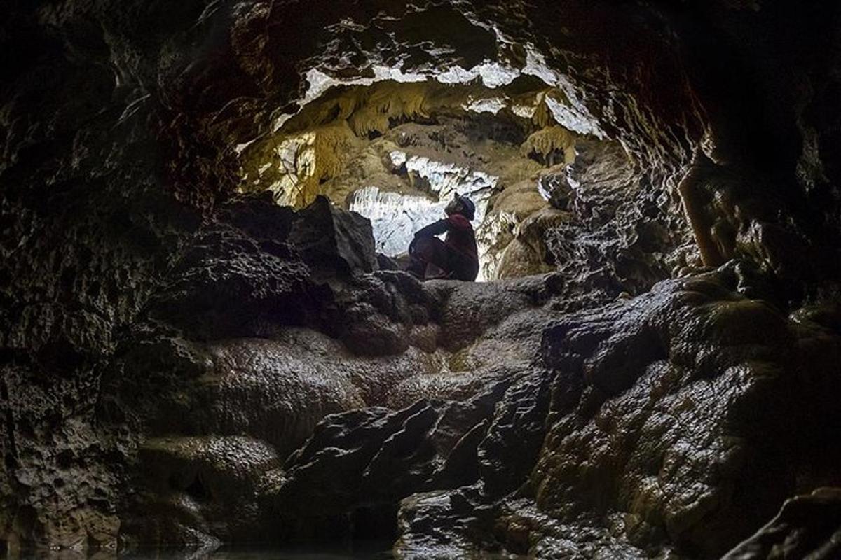 a man is standing in a cave