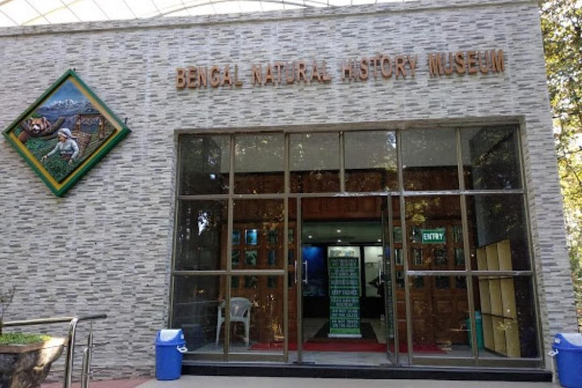 a brick building with a door and a sign on it