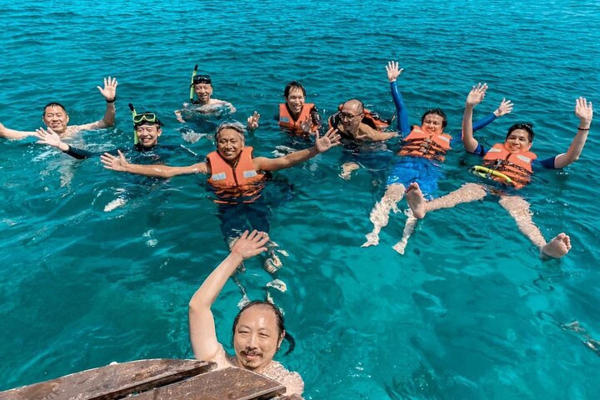 a group of people swimming in the water
