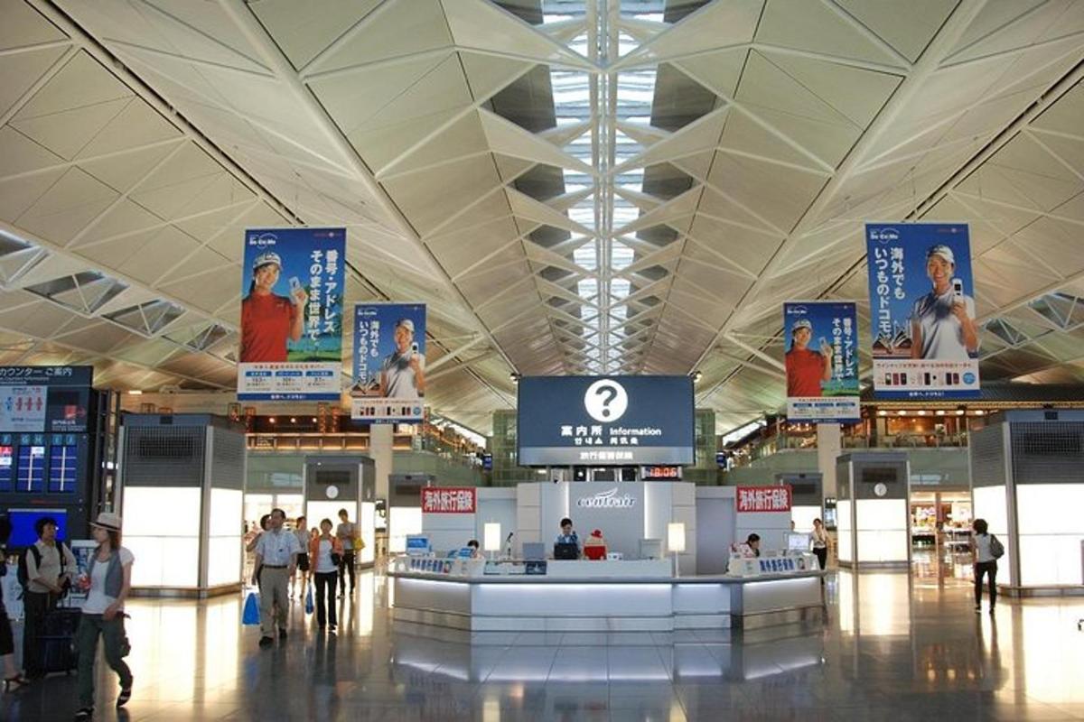 a large airport with people walking around a terminal