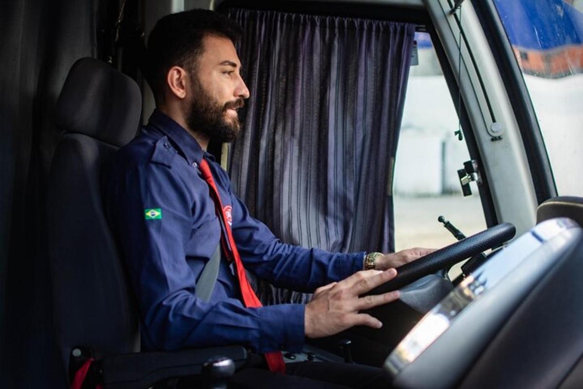 a man with a beard sitting in a truck
