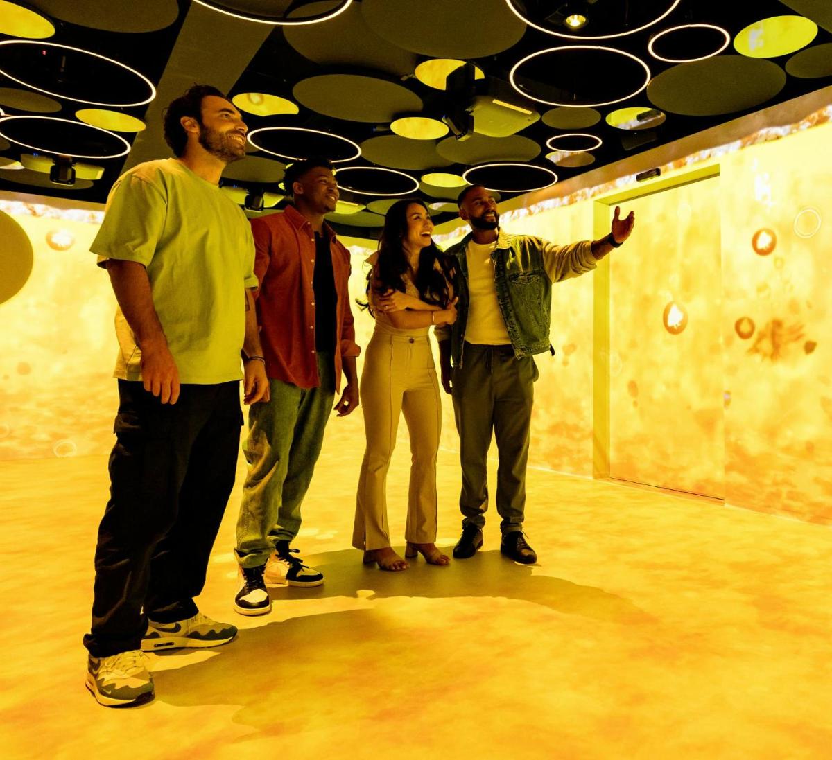 a group of people standing in a room