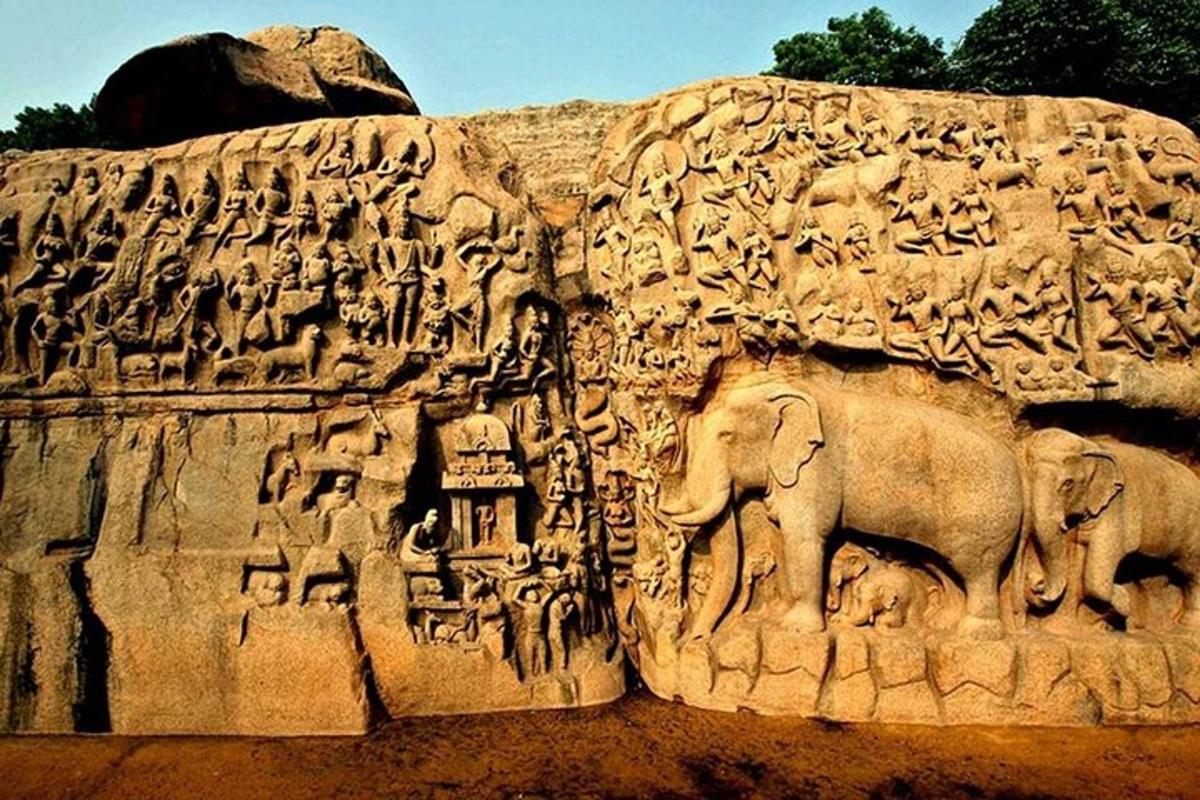 a large stone wall with animals on it