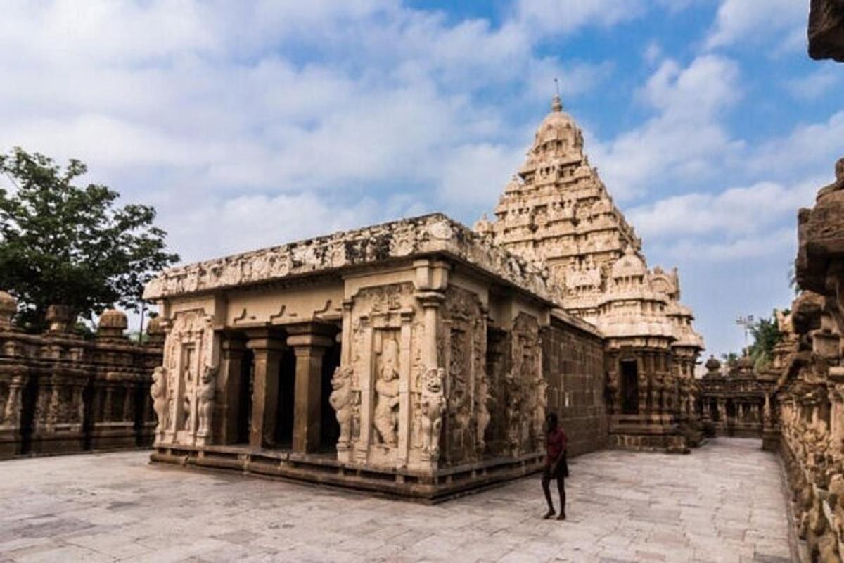 a person standing in front of a stone building