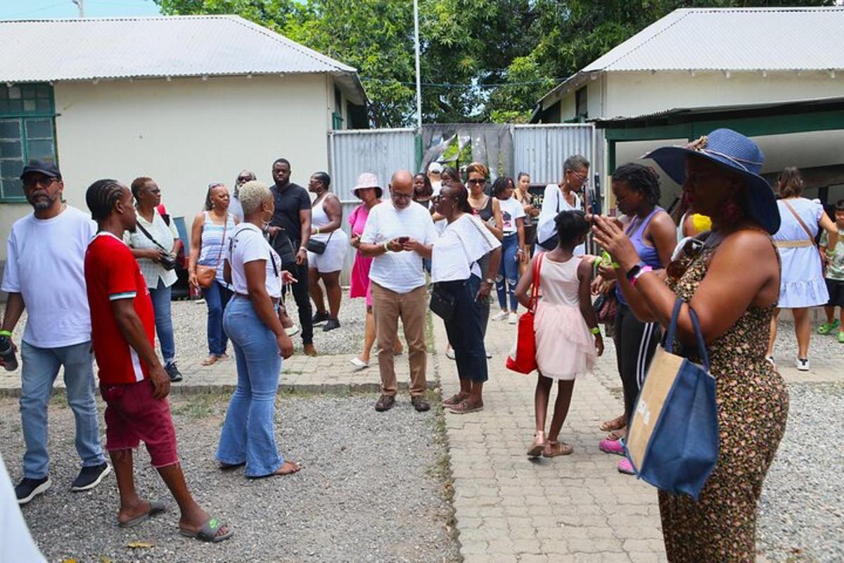 a crowd of people standing outside a building