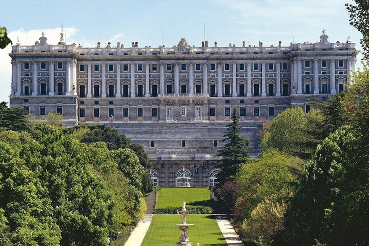 a large building with a garden in front of it