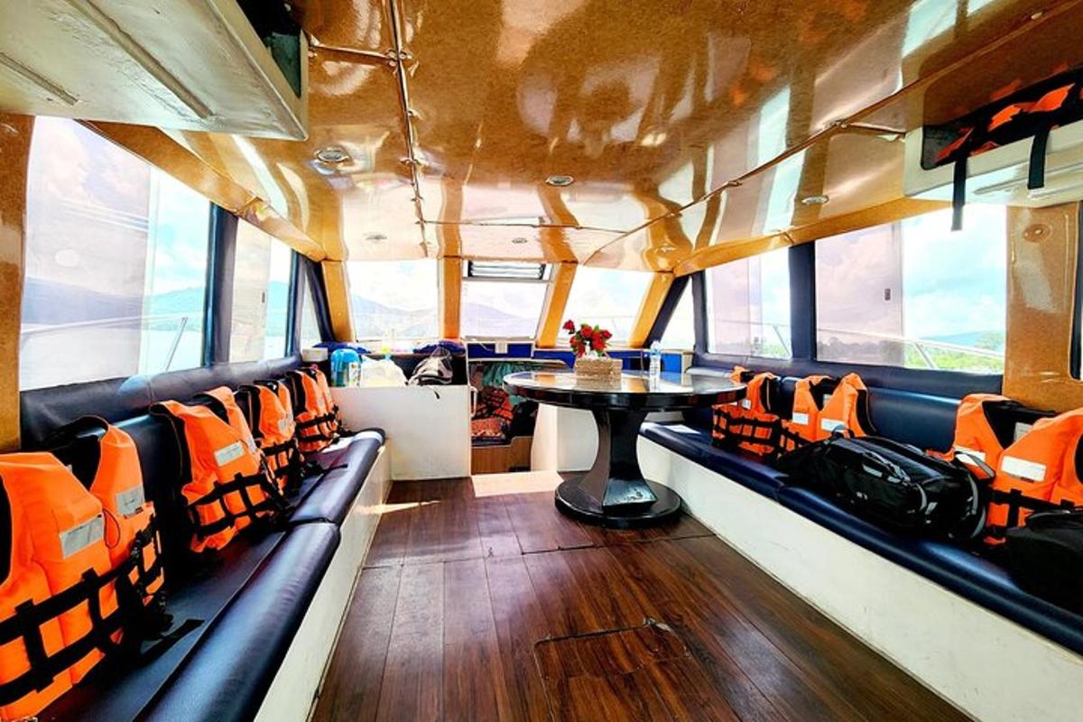 a dining area of a bus with a table and chairs