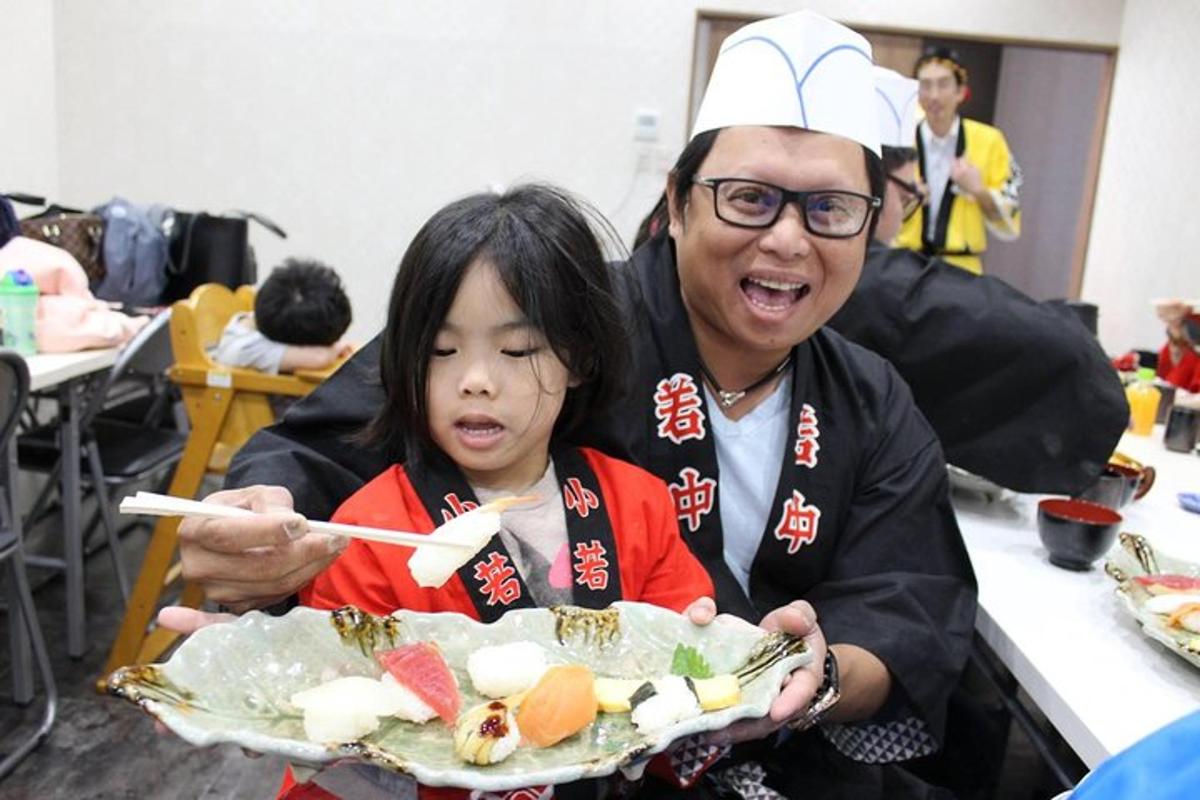 a man and a girl holding a plate of food