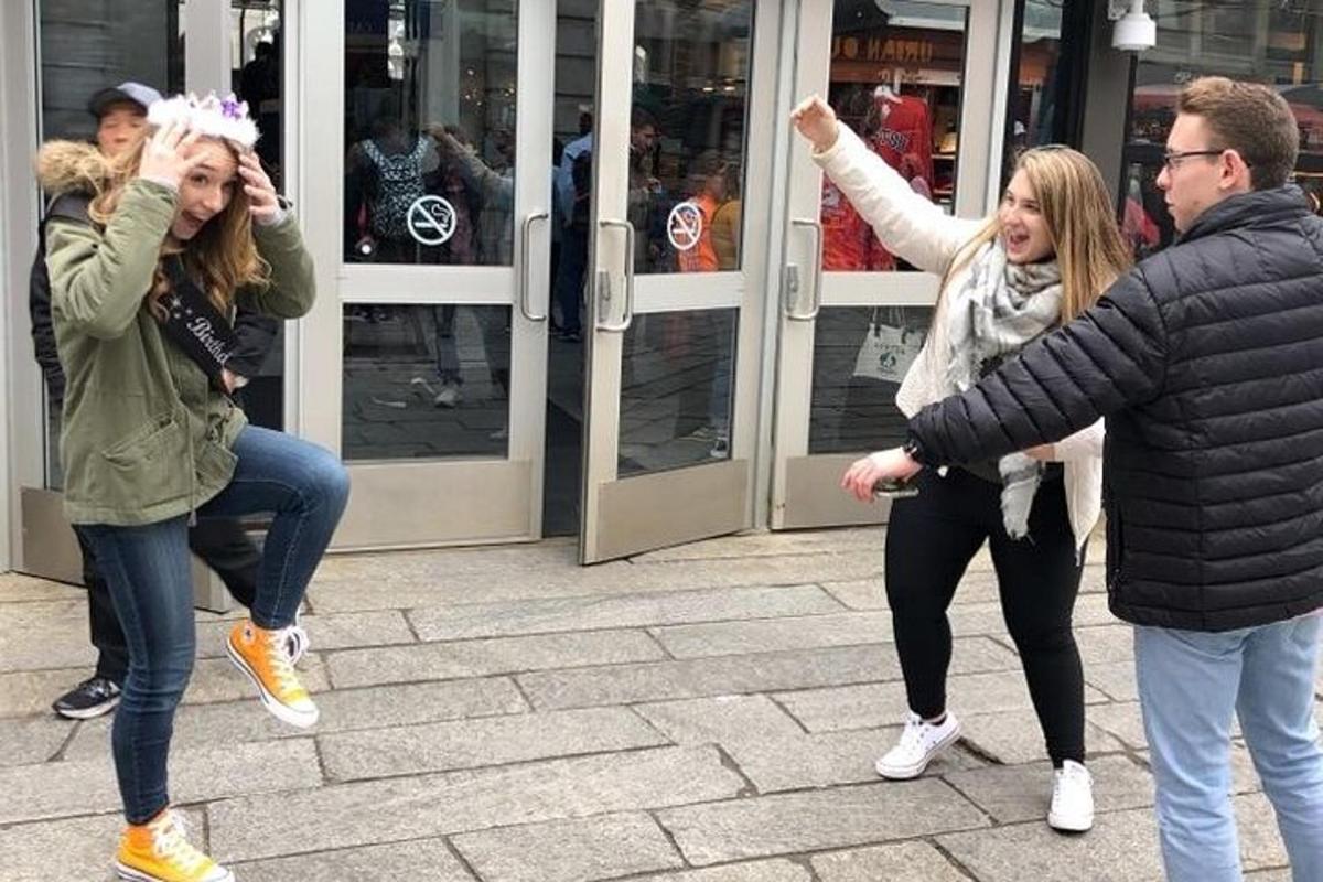 a group of people dancing in front of a store
