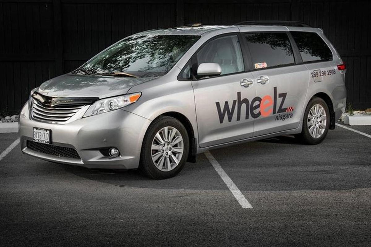 a silver van parked in a parking lot